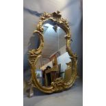 A Roccoco style giltwood mirror.