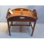 A mahogany butlers tray on stand.