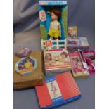 A collection of vintage toys including a Sindy doll styling head,