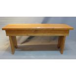 A 20th Century light oak bench.