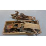 A collection of vintage toys to include three block planes.