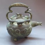 A Chinese bronze teapot decorated with various animals.