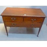 An Edwardian mahogany side table with two short over one long drawer having boxwood inlay raised on