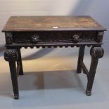 A Victorian carved oak side table with single drawer.