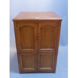 An early 20th Century oak side cabinet with four doors,