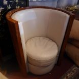 A pair of simulated rosewood tub chairs with leather seats.