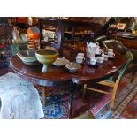 A Victorian rosewood tilt top breakfast table with cartouche top,