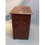 A 19th Century mahogany side chest of four drawers raised on bun feet.