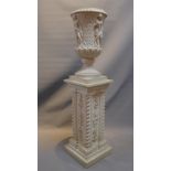 A French urn mounted on a column base.