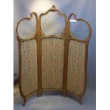 A Rococo style giltwood three way folding screen with glass upper panels and green and red