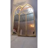 A pair of Gothic style garden mirrors