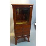 A burr walnut side cabinet with bevelled glass door over 3 short drawers,