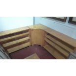 A mid 20th Century maple wood corner cabinet with central cupboard door flanked by four sliding