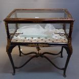 A 20th Century French bijouterie table with bevelled glass panels,