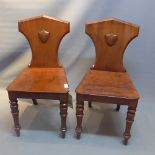 A pair of mahogany hall chairs.