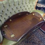 A large early 20th Century mahogany butlers tray with hinged sides,