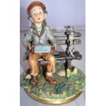 Studio art pottery - boy sat on bench playing instrument with dog