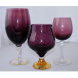Collection of three purple art glass vases