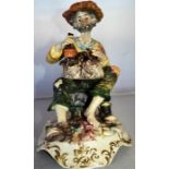 Studio art pottery - man sitting with shoe (AF)