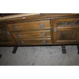 AN OAK OLD CHARM LINEN FOLD SIDEBOARD