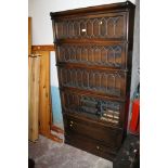 A TALL LEADED GLASS GLOBE WERNICKE STACKING BOOKCASE