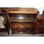 AN OAK OPEN FRONTED BOOKCASE