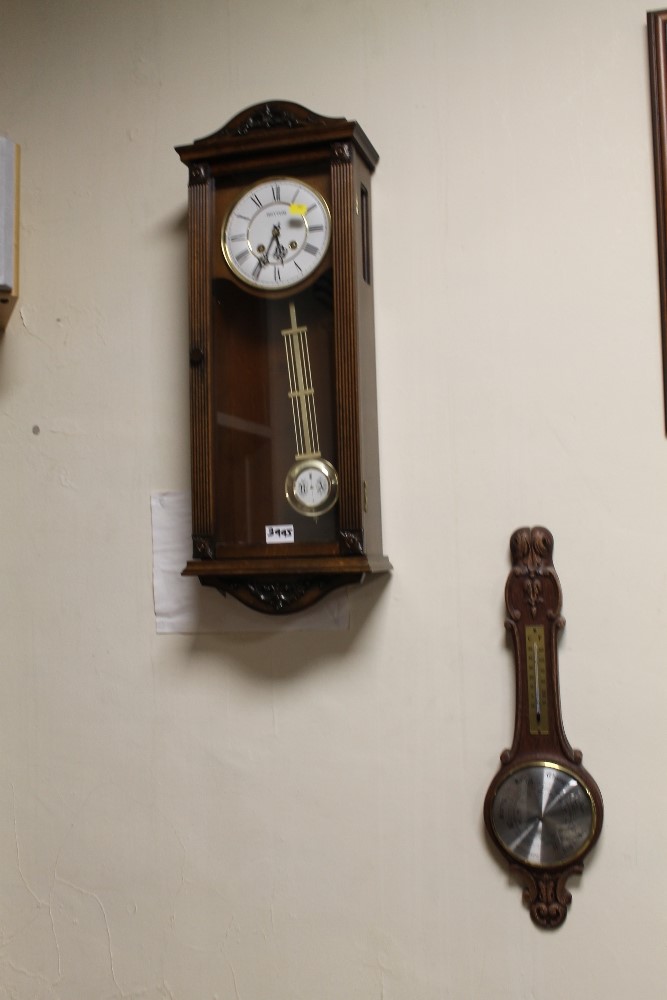 A RHYTHM WALL CLOCK TOGETHER WITH A BAROMETER