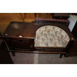 AN OAK LINEN FOLD TELEPHONE TABLE