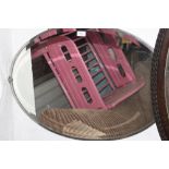 AN ART DECO STYLE OVAL WALL MIRROR