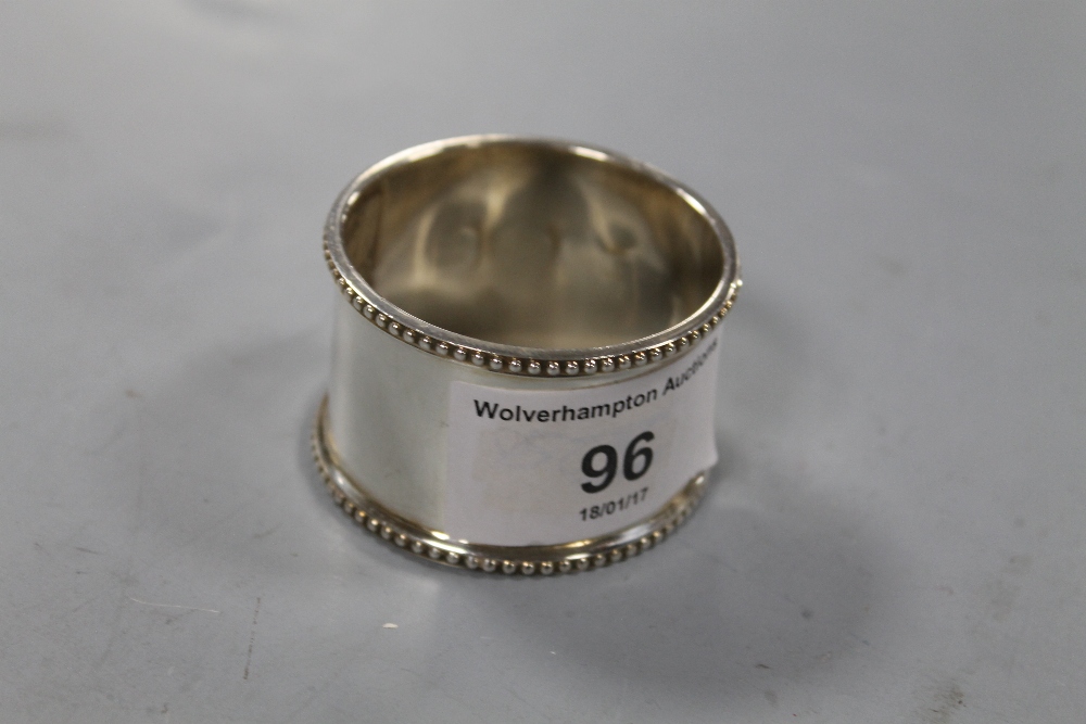 A HALLMARKED SILVER NAPKIN RING