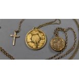 A GOLD LOCKET TOGETHER WITH A CROSS MEDALLION AND CHAINS