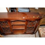 AN OAK OLD CHARM OPEN FRONT BOOKCASE WITH LEADED GLASS DOORS