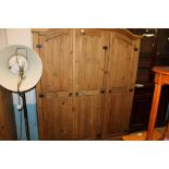 A PINE COLONIAL STYLE TRIPLE WARDROBE