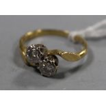 A GOLD TWO STONE DIAMOND RING