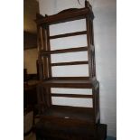 A GOTHIC STYLE OAK OPEN FRONT BOOKCASE