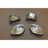 A PAIR OF SILVER PLATED SALTS ON LIVERBIRD FEET + ANOTHER PAIR
