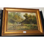 A GILT FRAMED OIL ON CANVAS DEPICTING FIGURES BY A RIVER