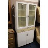 A RETRO GLAZED KITCHEN CABINET