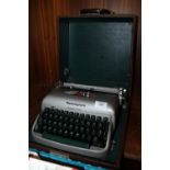 A CASED REMINGTON TRAVEL TYPEWRITER