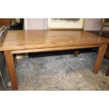 A LARGE MODERN PINE DINING TABLE