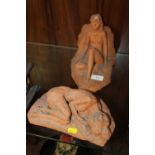 A PAIR OF TERRACOTTA STYLE STUDIO POTTERY FIGURES MARKED 'HE'