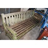 A LARGE WOODEN GARDEN BENCH