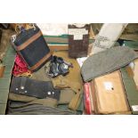 A BOX OF ASSORTED MILITARY ITEMS