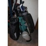 THREE BAGS PLUS A SET OF CADDY WHEELS TOGETHER WITH A SELECTION OF GOLF CLUBS