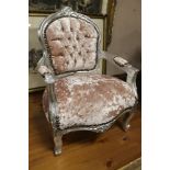 A SMALL SILVER UPHOLSTERED CHILD'S ARMCHAIR