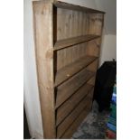 AN ANTIQUE PINE OPEN BOOKCASE