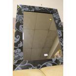 A MODERN PATTERENED WALL MIRROR