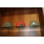 THREE WW2 ERA ARMOURED CORPS HELMETS IN VARIOUS COMPLETENESS / CONDITION