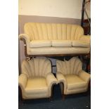 AN ART DECO SHAPED THREE PIECE UPHOLSTERED SUITE