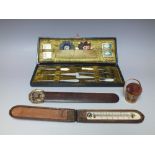 COLLECTORS LOT - A MAUCHLIN WARE PIN CUSHION, a cased thermometer, cased sewing set and a page turn